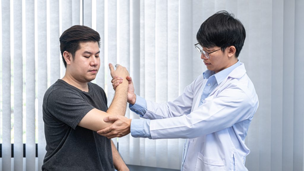 Physiotherapist chiropractor provide treatments to patient
